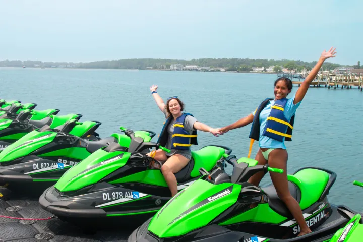 Sierra Scott riding a motorcycle next to a body of water