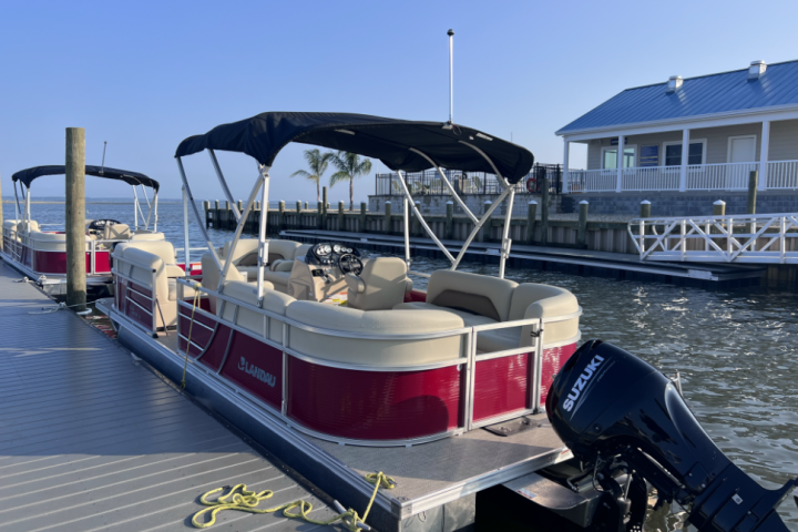 a boat is docked next to a body of water