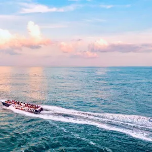 a body of water with smoke coming out of the ocean