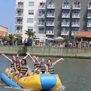 a group of people riding on the back of a boat