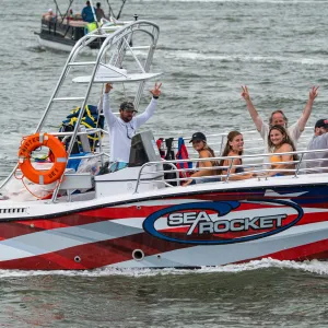 a group of people on a boat in the water