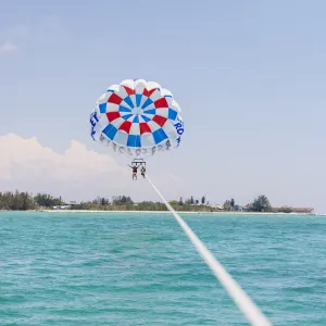 a parachute is sitting next to a body of water