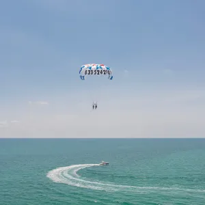 a parachute with a body of water