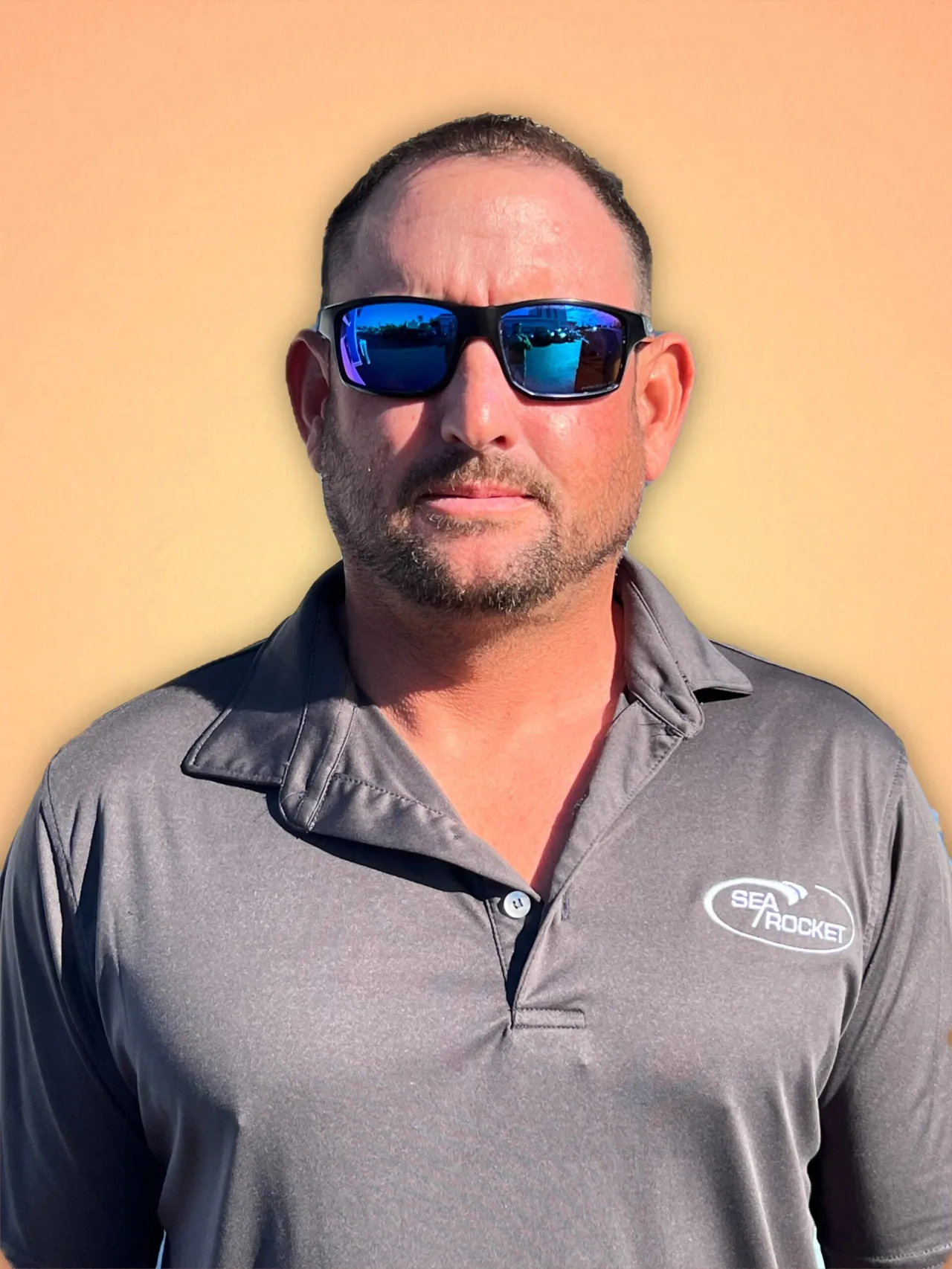 Mark LoMonaco wearing sunglasses posing for the camera