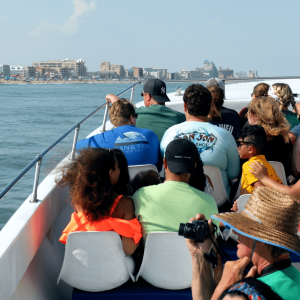 a group of people in a boat on a body of water