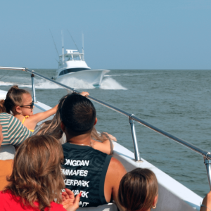 a group of people in a boat on a body of water