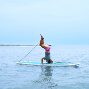 a man riding on the back of a boat in a body of water
