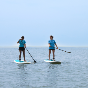 a man riding a surf board on a body of water