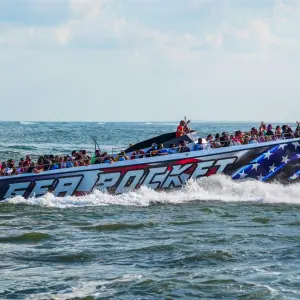 a group of people on a boat in the water