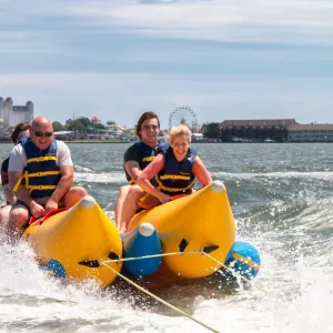 a man riding on a raft in a body of water