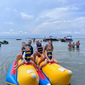 a group of people on a raft in a body of water