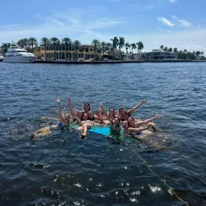 a group of people swimming in a body of water