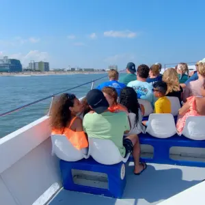 a group of people on a boat in the water