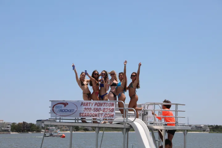 a group of people riding on the back of a boat